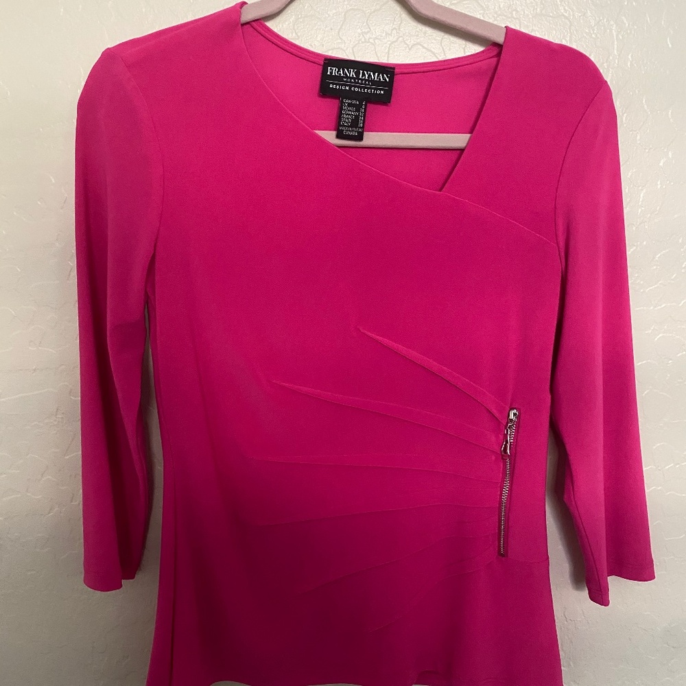 Frank Lyman Pink Blouse with a zipper detail.